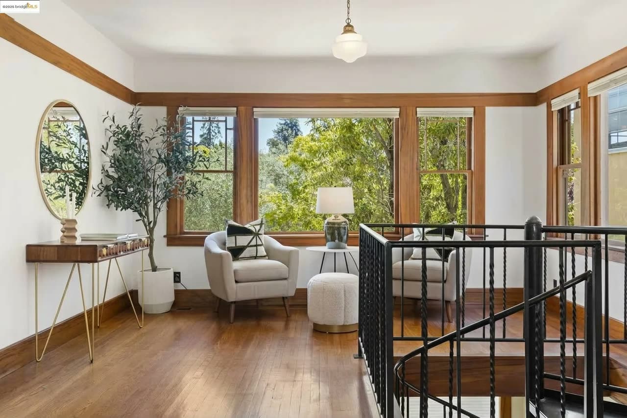 An upstairs reading nook, tucked beside the stair landing.