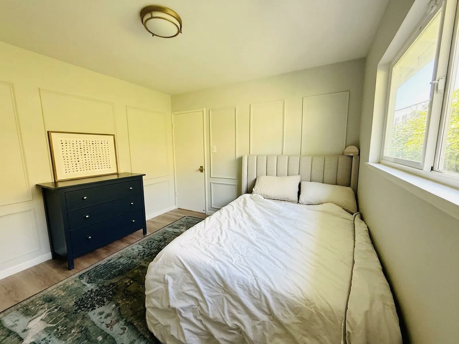 A guest bedroom, quiet and unhurried.