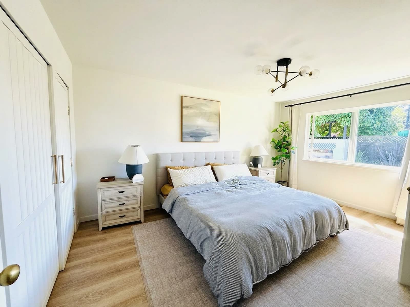 The primary bedroom, looking out toward the garden.